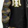 Scarface Black and Yellow Tony Montana Varsity Bomber Jacket Closeup on Sleeves